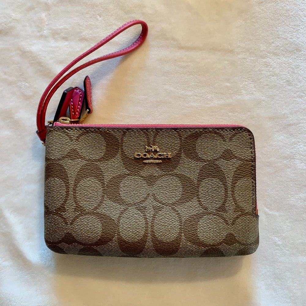 Coach Double Corner Zip Wristlet in Signature Canvas with pink accent trim